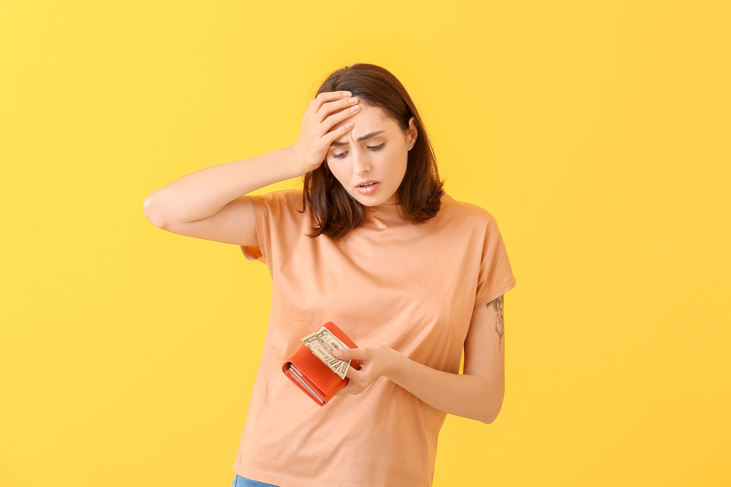 Sad Young Woman with Wallet and Money on Color Background